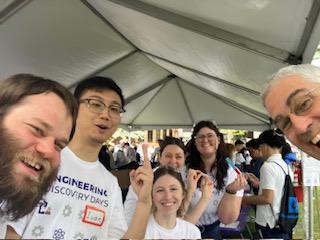 MEM-C students and faculty at a booth for UW Engineering Discovery Days